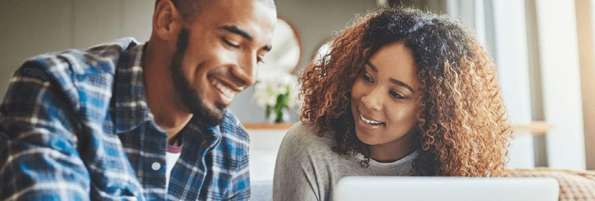couple looking at computer couple looking at computer