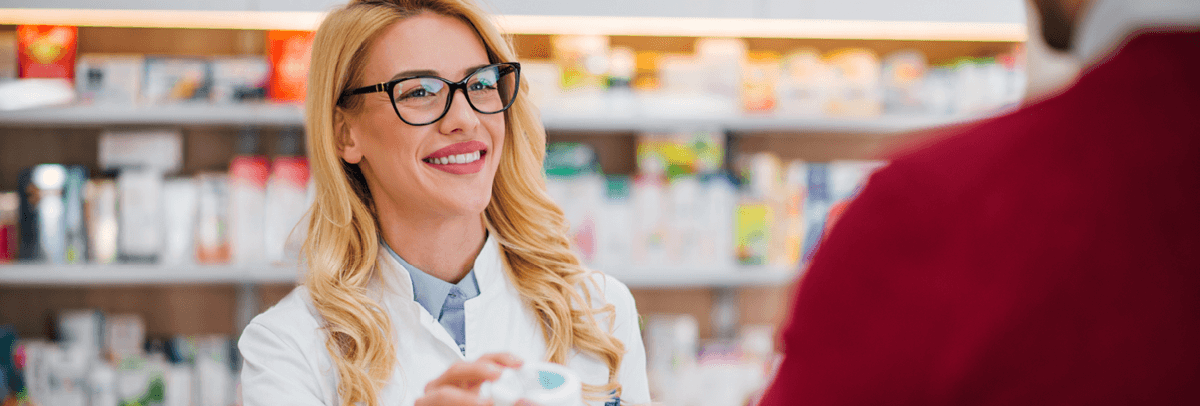 female pharmacist helping client female pharmacist helping customer