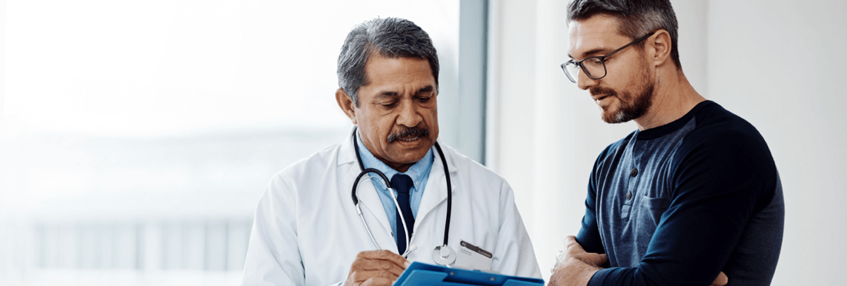 1200x406_male doctor with male patient male doctor with male patient