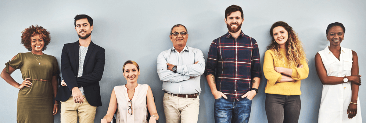 1200x406_office colleagues standing against wall office colleagues standing against wall